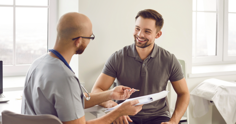 Doctor with a clipboard talking to a patient