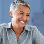 woman with grey hair smiling