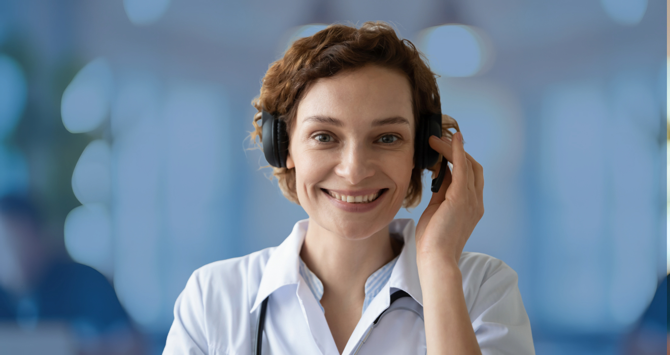 woman smiling holder her headset