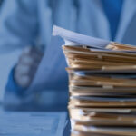 pile of files by a doctor